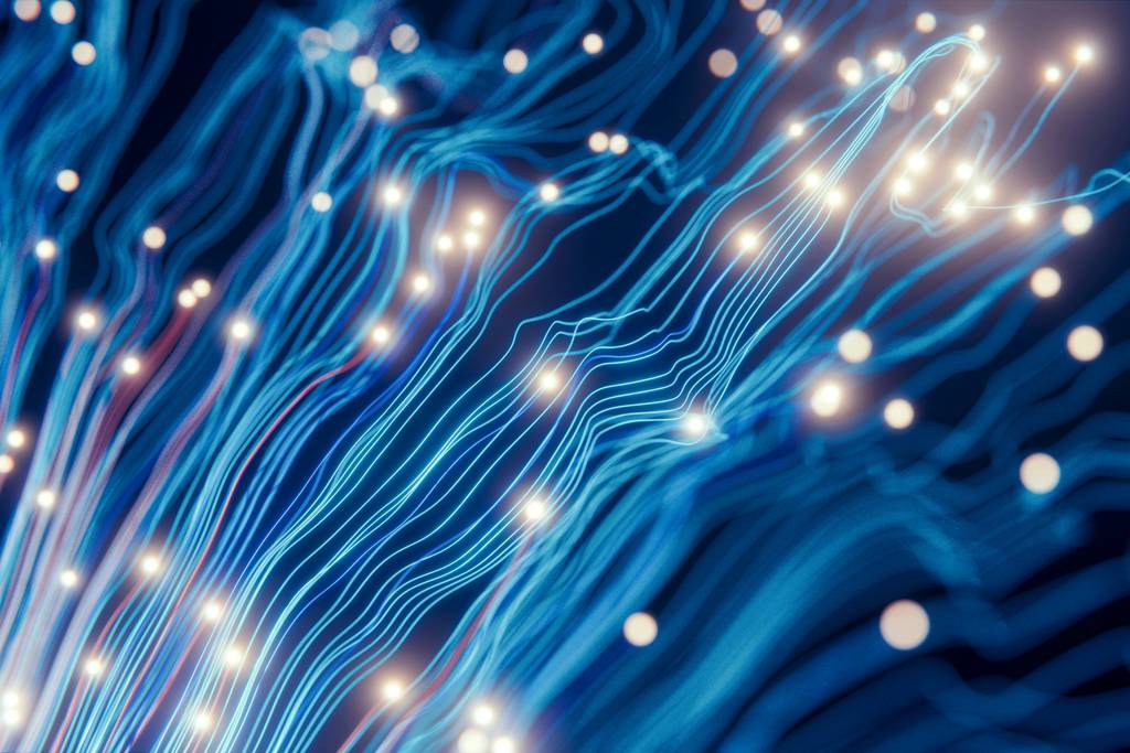 Des filaments lumineux bleus s’étirent et se croisent sur un fond sombre